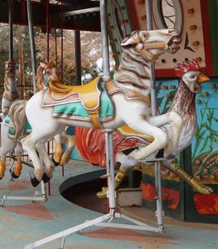 A picture containing carousel, outdoor object, ride, indoor

Description automatically generated