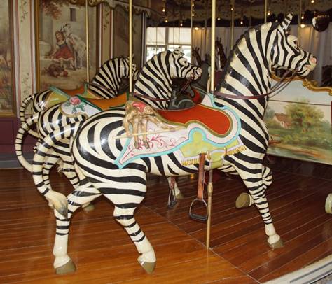 A zebra and a zebra in a museum

Description automatically generated with low confidence