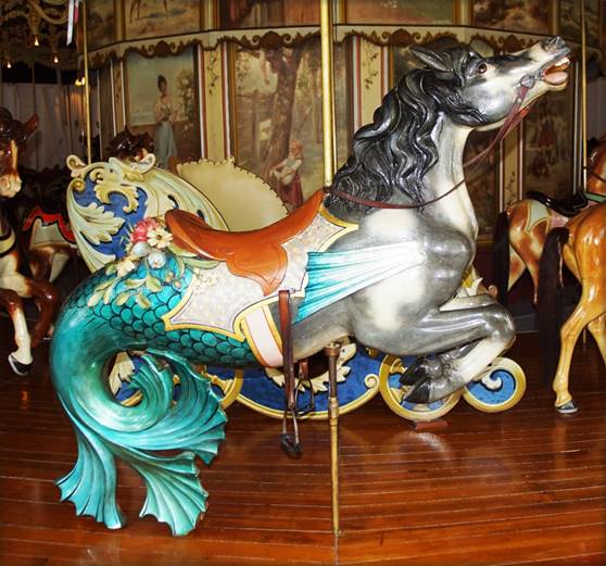 A picture containing indoor, floor, carousel, ride

Description automatically generated