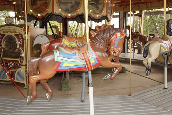 A picture containing carousel, outdoor object, ride, floor

Description automatically generated