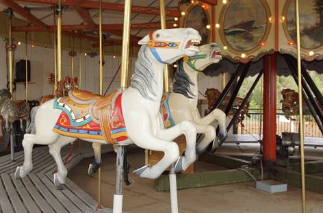A picture containing outdoor object, carousel, floor, ride

Description automatically generated