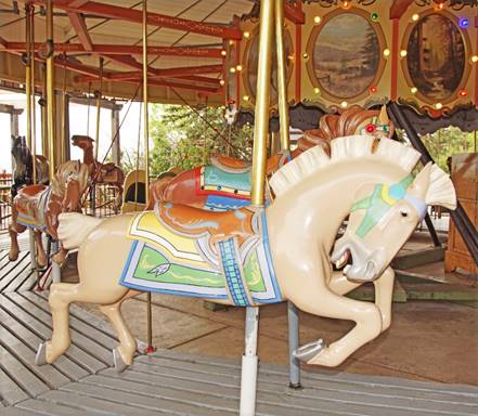 A picture containing outdoor object, carousel, ride

Description automatically generated