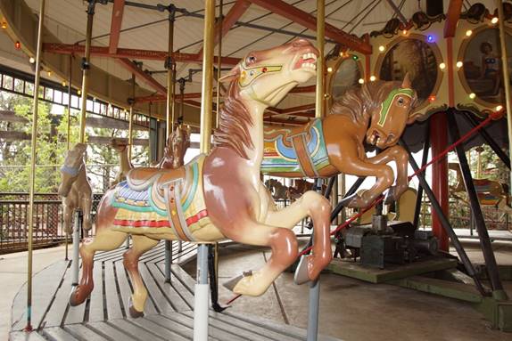 A picture containing carousel, ride, outdoor object

Description automatically generated