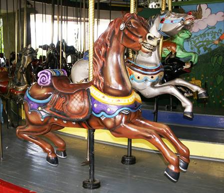 A picture containing carousel, ride, outdoor object, indoor

Description generated with very high confidence