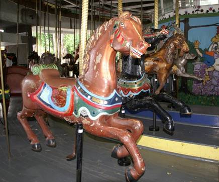A picture containing building, carousel, outdoor, outdoor object

Description generated with very high confidence