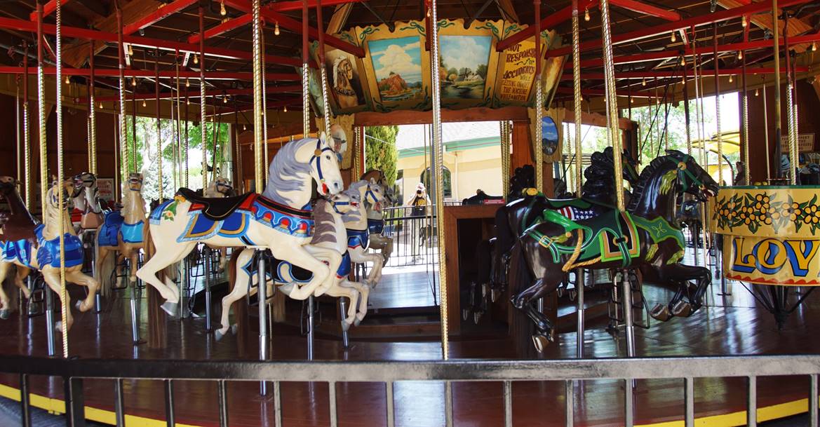 A picture containing carousel, outdoor object, ride

Description automatically generated