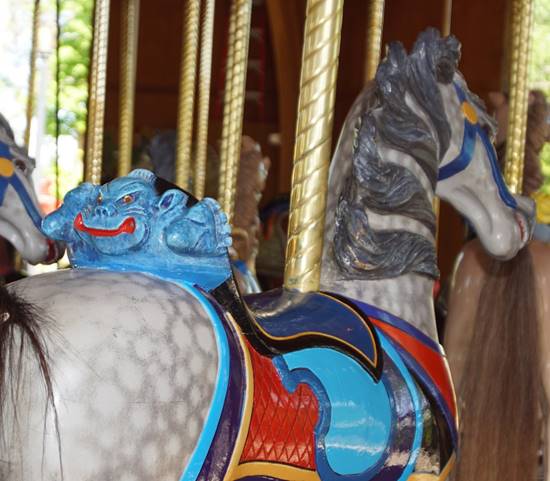 A picture containing carousel, outdoor object, ride, parachute

Description automatically generated