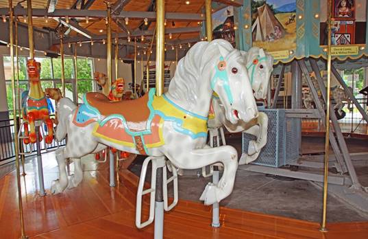A picture containing carousel, outdoor object, ride, floor

Description automatically generated