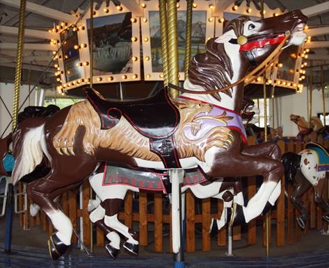 A picture containing carousel, ride, outdoor object, indoor

Description automatically generated