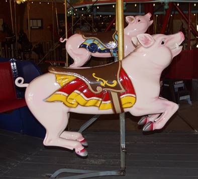 A person sitting on a carousel

Description automatically generated
