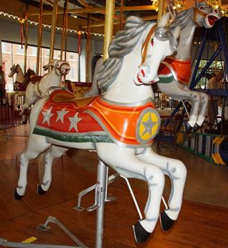 A picture containing carousel, floor, outdoor object, indoor

Description automatically generated