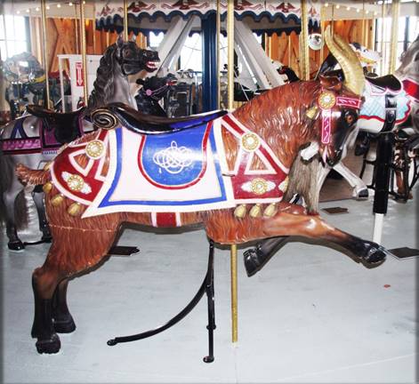 A horse carousel with a saddle

Description automatically generated with medium confidence