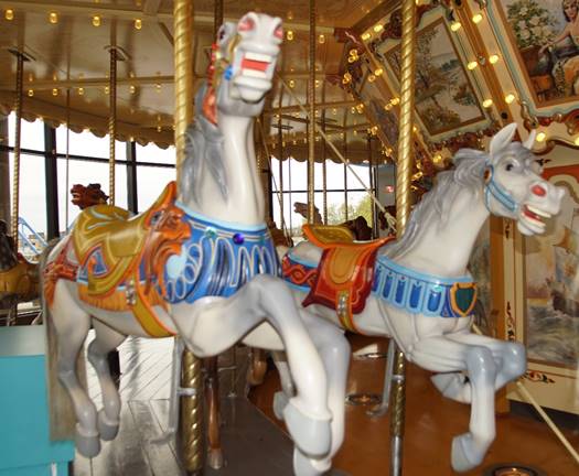 A picture containing carousel, outdoor object, ride, indoor

Description automatically generated