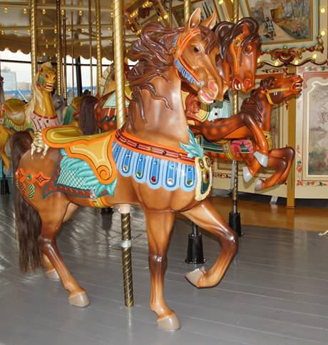 A picture containing carousel, ride, floor, building

Description automatically generated