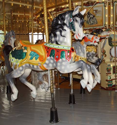 A picture containing carousel, floor, indoor, ride

Description automatically generated