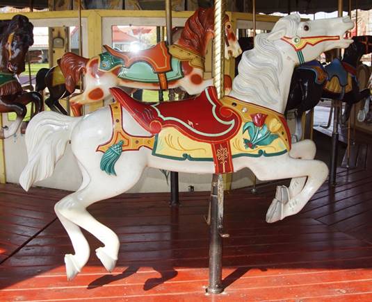 A picture containing indoor, floor, carousel, table

Description automatically generated