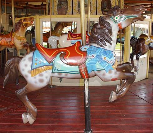 A picture containing carousel, indoor, outdoor object, floor

Description automatically generated