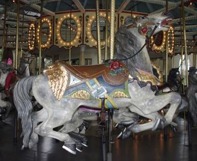 A close up of a carousel

Description generated with very high confidence