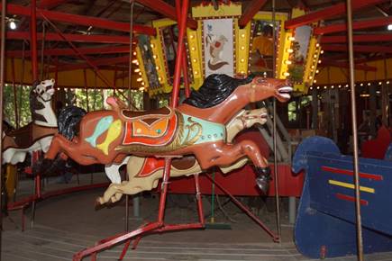 A picture containing carousel, floor, ride, outdoor object

Description generated with very high confidence