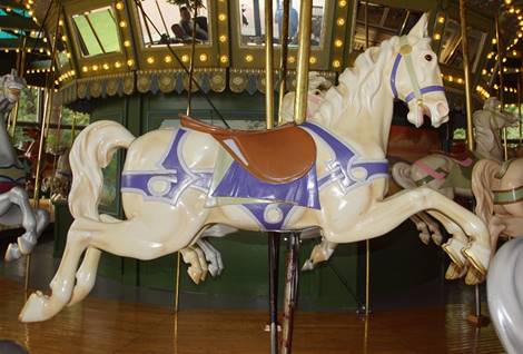 A picture containing carousel, outdoor object, ride, table

Description automatically generated