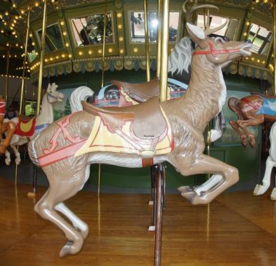 A picture containing outdoor object, floor, carousel, indoor

Description automatically generated