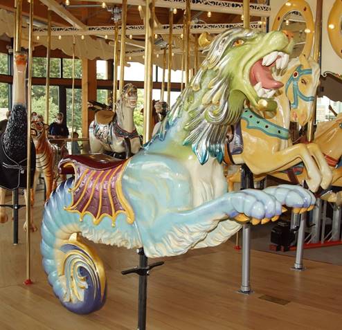 A picture containing carousel, floor, outdoor object, ride

Description automatically generated
