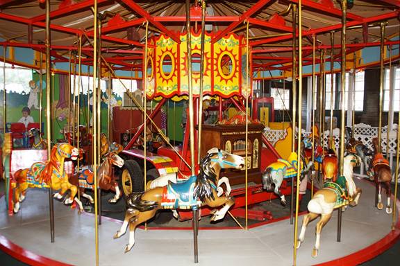 A picture containing carousel, outdoor object, ride, colorful

Description automatically generated