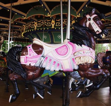 A picture containing carousel, ride, floor, indoor

Description automatically generated