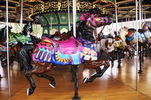 A picture containing carousel, floor, ride, outdoor object

Description automatically generated