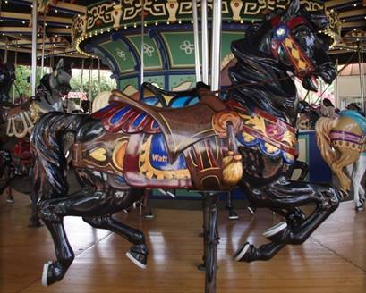 A picture containing floor, carousel, ride, indoor

Description automatically generated