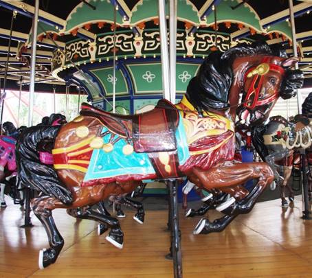 A picture containing text, floor, carousel, ride

Description automatically generated