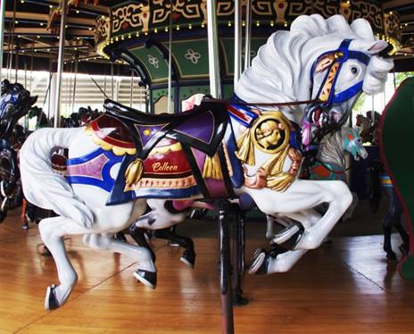 A picture containing floor, indoor, carousel, ride

Description automatically generated