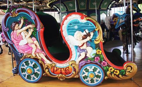 A picture containing carousel, decorated, ride

Description automatically generated