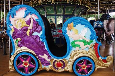 A picture containing decorated, colorful, painted, carousel

Description automatically generated