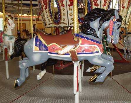 A horse on a merry go round

Description automatically generated