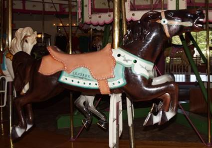 A picture containing floor, indoor, outdoor object, carousel

Description generated with very high confidence