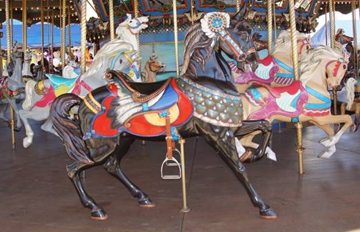 A picture containing carousel, ride, outdoor object, floor

Description generated with very high confidence
