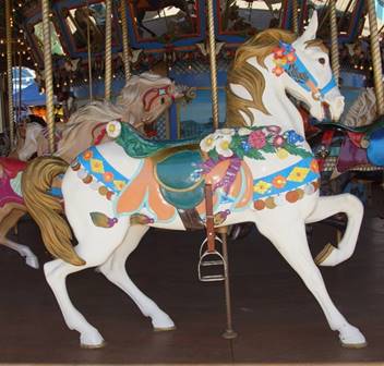 A person riding a horse in a carousel

Description generated with high confidence