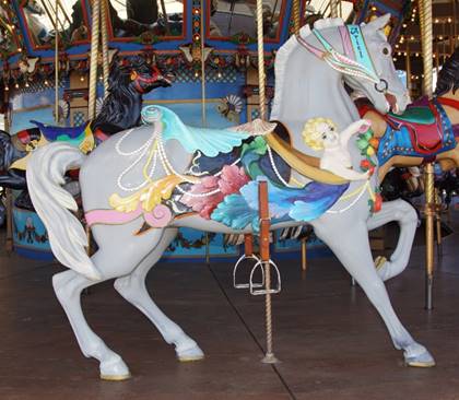 A picture containing carousel, floor, ride, indoor

Description generated with very high confidence