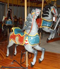 A picture containing carousel, indoor, floor, ride

Description generated with very high confidence