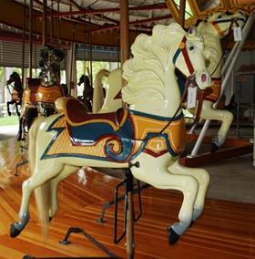 A picture containing indoor, floor, carousel, sitting

Description generated with very high confidence