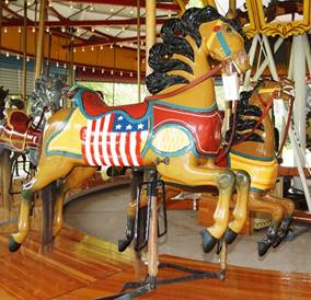 A picture containing floor, indoor, carousel, ride

Description generated with very high confidence