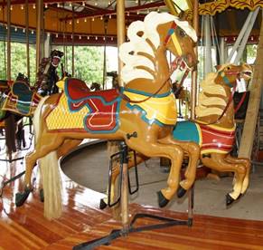 A chair sitting in front of a carousel

Description generated with high confidence