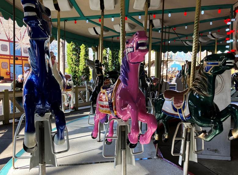 A group of horses on a merry go round

AI-generated content may be incorrect.