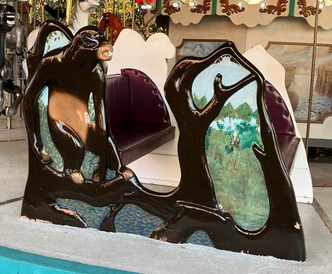 A statue of a monkey on a tree branch

AI-generated content may be incorrect.