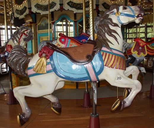 A picture containing carousel, ride, outdoor object, indoor

Description automatically generated